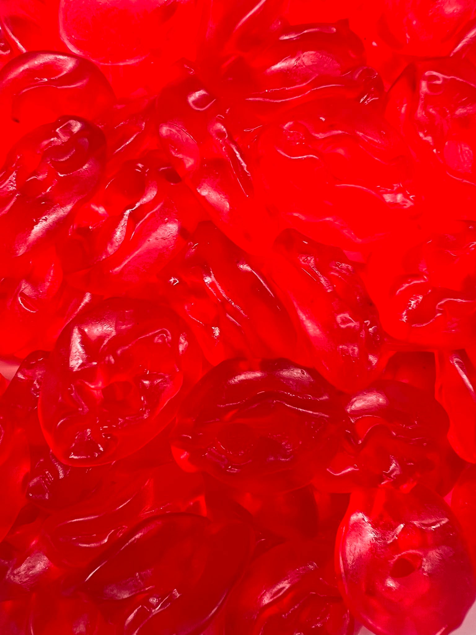 Roze Mutsjes Poesjes – glanzende rode winegums in mutsjesvorm van Snoepkes.nl
